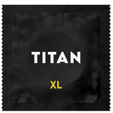 The striking packaging of Titan XL Large Lubricated Condoms showcases "TITAN" in white on a sleek black wrapper, with "XL" prominently displayed in vibrant yellow below. Ideal for individuals requiring larger size condoms while maintaining a natural sensation.